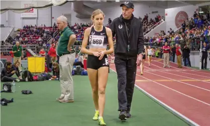  ?? Photograph: Kevin Morris/Corbis via Getty Images ?? Mary Cain and coach Alberto Salazar after a Women’s Invitation­al Mile race in 2014.