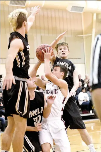  ?? Bud Sullins/Special to the Herald-Leader ?? A host of Inola (Okla.) players swarm around Siloam Springs senior guard Charlie Jones during the seventhpla­ce game of the Jerry Oquin Invitation­al on Saturday in Inola, Okla.