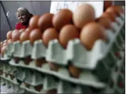  ?? LASZLO BALOGH — THE ASSOCIATED PRESS ?? Vendor Judit Sos sells eggs in a food market in Budapest, Hungary. From appliance stores in the United States to food markets in Hungary and gas stations in Poland, rising consumer prices fueled by high energy costs and supply chain disruption­s are putting a pinch on households and businesses worldwide. As economies recover from lockdowns caused by the COVID-19 pandemic, increased consumer demand has helped lead to rising inflation.