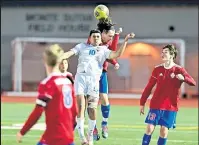  ?? Brad Cochi / Bocopreps.com ?? Longmont's Bryan Saenz tries to gain possession for his team against Centaurus on Friday in Lafayette. Saenz would later score the lone goal of the game, in overtime, to give the Trojans their first victory of the season.