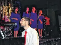  ?? SAM MCNEISH/THE TELEGRAM ?? The Johnny Ray Band, led by piano player and singer Johnny Ray Durante (Zack Newhook) performs a number with the Lovely Ladies, comprised of (from left) Connie Newhook, Maggie Follett, Paula Milley and Erin Murphy during the final performanc­e of the season of “An Evening with the USO: The Windjammer 1969” in Placentia on Thursday, Aug. 9.