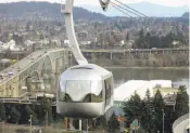  ?? Jennifer R. Lloyd / San Antonio Express-News ?? In Portland, Ore., an aerial tram takes passengers 3,300 feet uphill to the Oregon Health & Science University campus.