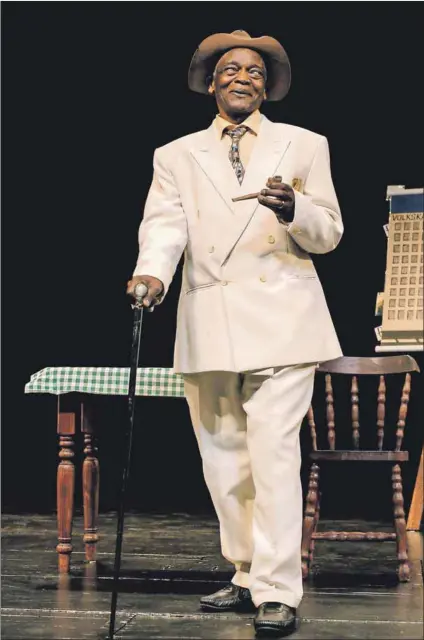  ??  ?? Ironman: Winston Ntshona (above) playing Sizwe Banzi in the Baxter Theatre production of Sizweat the National Arts Festival in 2006. A photograph from 1973 (left) shows playwright Athol Fugard flanked by Ntshona (right) and actor John Kani, when the play was staged at the Royal Theatre Court in London.