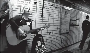  ??  ?? Going Undergroun­d: Kirsten Mcclure sings for London tube travellers