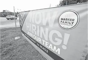  ??  ?? A sign advertises jobs at a McDonald's in Moss Point, Miss., last year. Hiring is picking up again. ROGELIO V. SOLIS/ AP