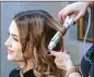  ?? MONICA ALMEIDA PHOTOS / ?? Kirsten Garlitos pays a visit to Glam &amp; Go at the Fairmont Miramar Hotel in Santa Monica, Calif. The salon opens at 7 a.m. and offers 15-minute express blowouts for $25. Glam &amp; Go plans to open several more locations during 2019.