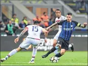  ??  ?? Inter Milan's Mauro Icardi (R) fights for the ball with Cagliari's Leandro Castan at The San Siro Stadium in Milan.