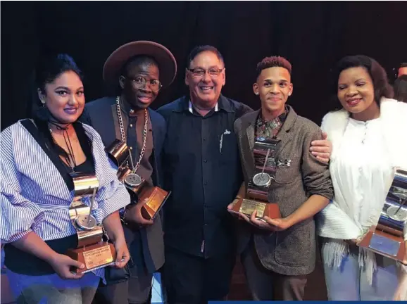  ?? PICTURES: CHRISTOPHE­R LAURENZ/SUPPLIED ?? Greg Wallis, centre, with four award-winners he has mentored from last year’s Durban Fashion Fair, from left, Leona Pillay, Athenkosi Mfungula, Martin Steenkamp and Claudia Novuka. Garment guru Greg Wallis, below left, is in demand as a master mentor.