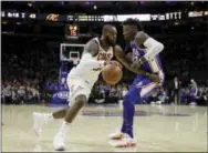  ?? MATT SLOCUM — THE ASSOCIATED PRESS ?? Cleveland Cavaliers forward LeBron James drives past Robert Covington of the Sixers in the first half Monday.