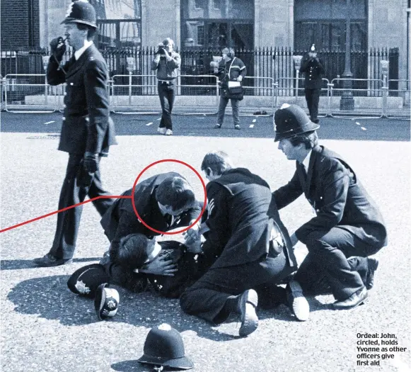  ?? Picture: MOHAMED MAKLOUF/REX FEATURES/ERIC BOUVET/GAMMA-RAPHO VIA GETTY IMAGES ?? Ordeal: John, circled, holds Yvonne as other officers give first aid