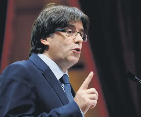  ??  ?? Deposed Catalan leader Puigdemont speaks during a confidence vote session at Catalan parliament, Barcelona.