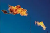  ?? Associated Press file photo ?? Flares burn off methane and other hydrocarbo­ns at an oil and gas facility in Lenorah, Texas. Under the Biden administra­tion’s Inflation Reduction Act, companies must start producing precise measuremen­ts of their methane emissions next year or face fines.