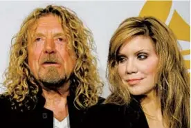  ?? AFP VIA GETTY IMAGES ?? VALERIE MACON
Former Led Zeppelin singer Robert Plant and bluegrass queen Alison Krauss have released a new album together.