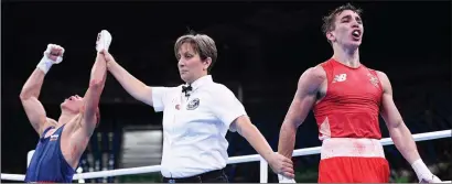  ??  ?? Vladimir Nikitin of Russia is declared victorious over Michael Conlan of Ireland during their Bantamweig­ht quarter final bout