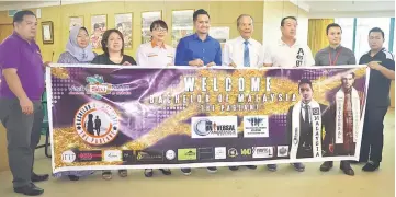  ??  ?? (From fourth left) Wong, Apohrozy and Tiong with others showing a banner for the event after the press conference.