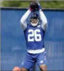  ?? FRANK FRANKLIN II — ASSOCIATED PRESS ?? Giants running back Saquon Barkley catches a pass during rookie minicamp on Friday in East Rutherford, N.J.