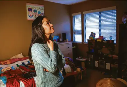  ?? ?? Truc-Co Jong looks around her daughter Ailee’s room in the family’s Danville home. Ailee, shown below in a photo held by her parents, died in 2019 on an operating table at John Muir Medical Center in Walnut Creek.