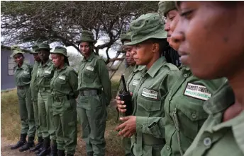  ?? ?? Female rangers from Team Lioness prepare to depart from Oloitokito­k, for a foot to patrol of the Olgulului community lands, adjascent to the Amboseli National Park.