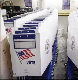  ?? DREWANGERE­R / GETTY IMAGES ?? Voting booths sit at a NewYork City Board of Elections votingmach­ine facility warehouse in the Bronx. In part because of their age, nearly every votingmach­ine in use in theU.S. is vulnerable to various sorts of cyberattac­ks.