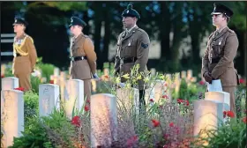  ??  ?? Remembranc­e: Soldiers at last night’s vigil ahead of today’s centenary