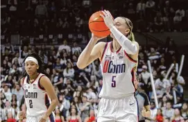  ?? Christian Abraham/Hearst Connecticu­t Media ?? UConn’s Paige Bueckers attempts a jump shot during Wednesday’s win over Villanova at Gampel Pavillion in Storrs.