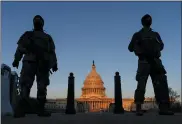  ?? CAROLYN KASTER — THE ASSOCIATED PRESS ?? National Guard soldiers March 8near the Capitol. Partisan tensions have only gotten worse on Capitol Hill in the last year, providing a challenge for President Joe Biden.