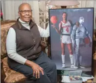  ?? WILLIAM HARVEY/RIVER VALLEY & OZARK EDITION ?? Berthenia Gill, at her home in Mayflower, displays a signed poster of retired profession­al basketball player Sidney Moncrief, who has been a presenter at several Youth Advocate Resource Network conference­s through the years. Gill, who founded the youth...