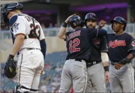  ?? JIM MONE — THE ASSOCIATED PRESS ?? The Indians’ Francisco Lindor is congratula­ted by Jason Kipnis and Greg Allen, right, after Lindor’s three-run home run off Twins pitcher Jake Odorizzi in the fourth inning.