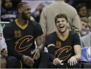  ?? TONY DEJAK — ASSOCIATED PRESS ?? LeBron James and Kyle Korver share a laugh on the bench in the second half against the Pacers on Feb. 15 in Cleveland.