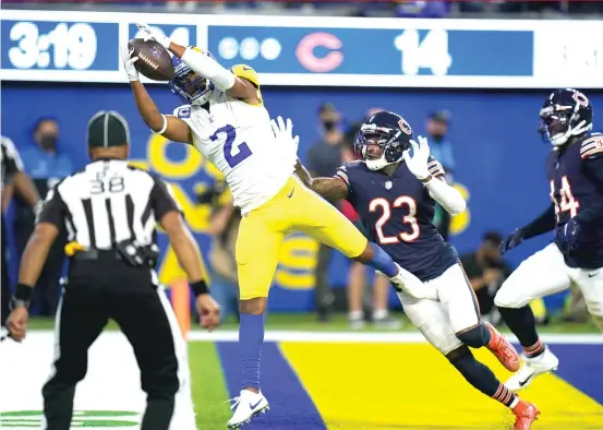  ?? JAE C. HONG/AP ?? Rams receiver Robert Woods snags a touchdown pass from Matthew Stafford in the fourth quarter Sunday against the Bears.