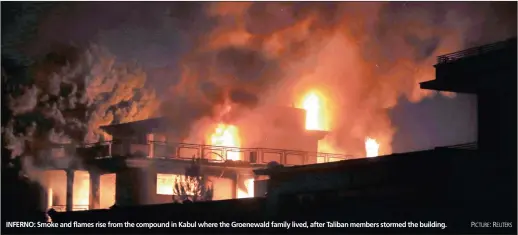  ?? PICTURE: REUTERS ?? INFERNO: Smoke and flames rise from the compound in Kabul where the Groenewald family lived, after Taliban members stormed the building.