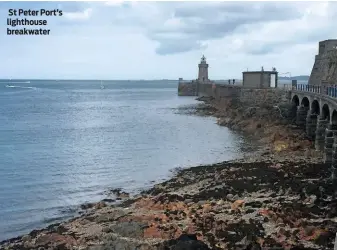  ??  ?? St Peter Port’s lighthouse breakwater