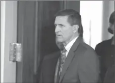  ?? Evan Vucci/AP ?? Adviser: Then-National Security Adviser Michael Flynn in the East Room of the White House in Washington. Two top House Democrats are questionin­g whether former Trump National Security Adviser Michael Flynn failed to report a 2015 trip to the Middle...