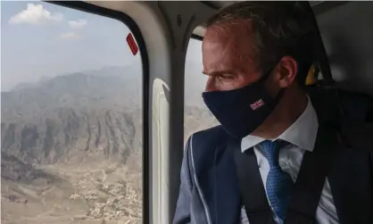  ?? Photograph: Simon Dawson/No10 Downing Street ?? Former foreign secretary Dominic Raab views the border between Afghanista­n and Pakistan from a helicopter.