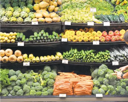  ?? AP ?? Vegetables are displayed for customers at a Ralphs grocery store in downtown Los Angeles.