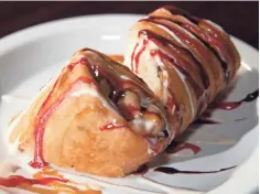  ??  ?? Wrapped and fried cheesecake is one of several desserts at Sabor Tropical.