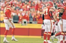  ?? AP ?? BACK IN THE GAME: Patrick Mahomes limps back to the huddle in Saturday’s 27-20 win over the Jaguars.