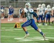  ??  ?? Orland’s Cody Baylor (9) takes off running Friday during the Trojan’s match up against Oroville at Harrison Stadium.