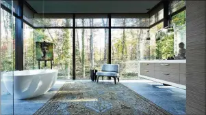  ?? COURTESY OF TISH MILLS/JEFF HERR ?? Light is an important sensory element in this Atlanta bathroom designed by Tish Mills.