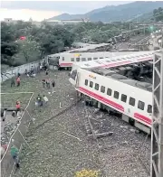  ?? REUTERS ?? An overturned train is seen in Yilan County, Taiwan on Oct 21, 2018 in this picture grab obtained from social media video.