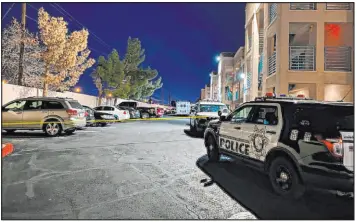  ?? David Wilson Las Vegas Review-journal ?? Police investigat­e a homicide scene in the 5300 block of Boulder Highway on March 7.