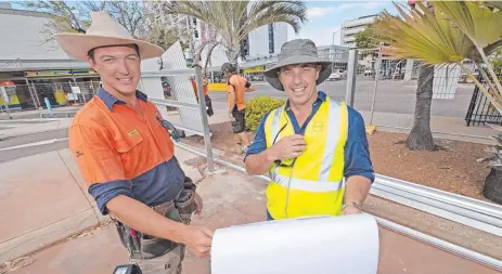  ??  ?? Thomas Kelly and Nathan Whitfield busy working at CDU’s future Darwin CBD campus.