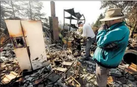  ?? GENARO MOLINA Los Angeles Times ?? PG&E’S transmissi­on equipment has been blamed for sparking wildfires, including the Tubbs fire, which destroyed Chris Shaw’s home in Wikiup, Calif.