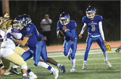  ??  ?? Cumberland seniors Isaiah Cole (2) and Dante Aviles-Santos (3) combined to produce all three of the Clippers’ touchdowns in Friday night’s 21-13 Division I victory over rival St. Raphael at Tucker Field.