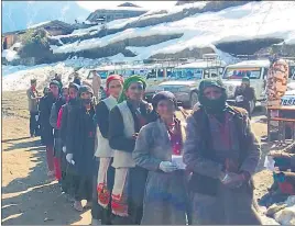  ?? HT PHOTO ?? Voters stand in a queue in Purola assembly constituen­cy, Uttarkashi.