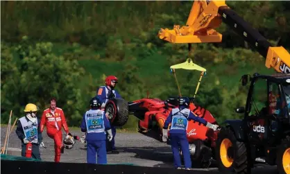  ?? Photograph: Douglas Magno/AFP via Getty Images ?? Sebastian Vettel is left unhappy after crashing out.