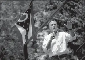  ?? AP/EVAN VUCCI ?? Republican presidenti­al candidate Mitt Romney speaks at a campaign stop Sunday at the Licking County Courthouse in Newark, Ohio.