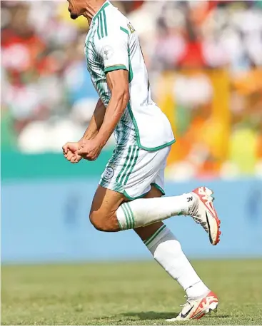  ?? ?? Algeria’s Baghdad Bounedjah celebrates after scoring against Burkina Faso on Saturday