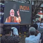  ?? ARUN CHANDRABOS­E/AFP VIA GETTY IMAGES ?? People watch “India: The Modi Question” in Kochi, India, last month.