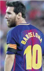  ??  ?? DEFIANT Messi with Barcelona on his shirt